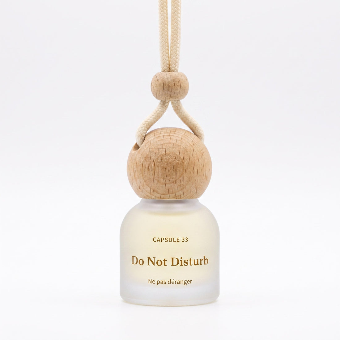 Capsule 33 Do Not Disturb hanging car perfume bottle, 10 ml frosted glass with a beech wood cap